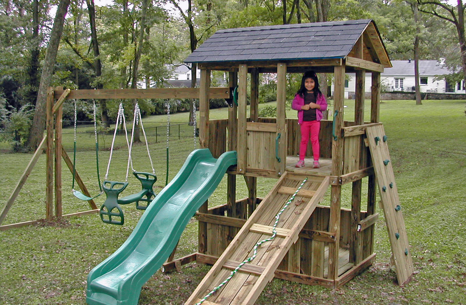 4x6 model as shown $2125.00 including Wooden Ramp with Rope, Green Rock Climbing Wall, Glider Horse, and Shingled Roof