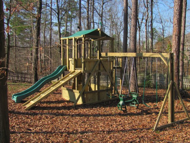 6x6 model as shown $2725.00 HOP's UPgrade, Wood Bridge, Grey Rock Climbing Walls, Fireman's Pole, Wooden Ramp with Rope, Swings, Glider Horse, and Periscope
