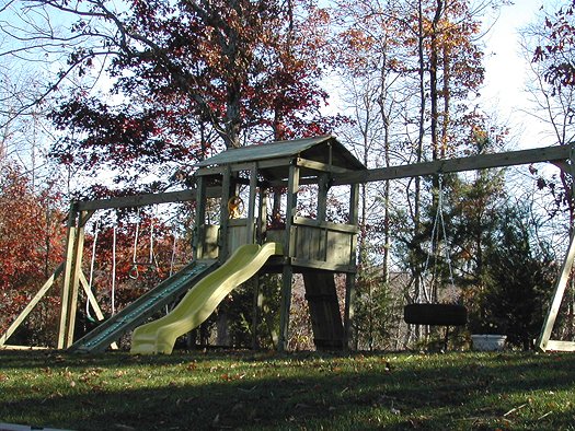 4x6 model as shown $2075.00 Wooden Ramp with Rope, Wooden Roof, Grey Rock Climbing Wall,Tire Swing,swings,trapeze