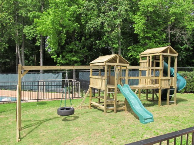 4x6 Eagle's Nest and 4x6 Jngle House models as shown $4050 including 8' Wave Slide, Enclosed Turbo Slide, Wooden Roofs, Picnic Table, Soft Grip Swings, Trapeze Bar with Rings, and Wooden Bridge