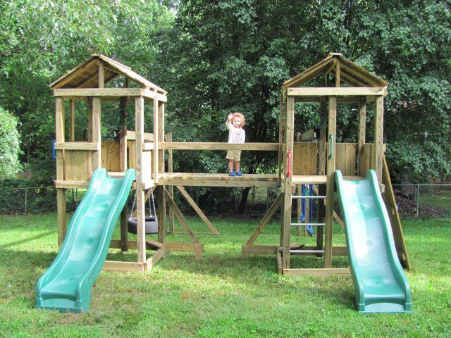 2 4x4 Jungle House models as shown $2995.00 including Wooden Bridge, Wooden Roofs, Tire Swing, Soft Grip Swings, Trapeze Bar with Rings, and Rock Climbing Wall